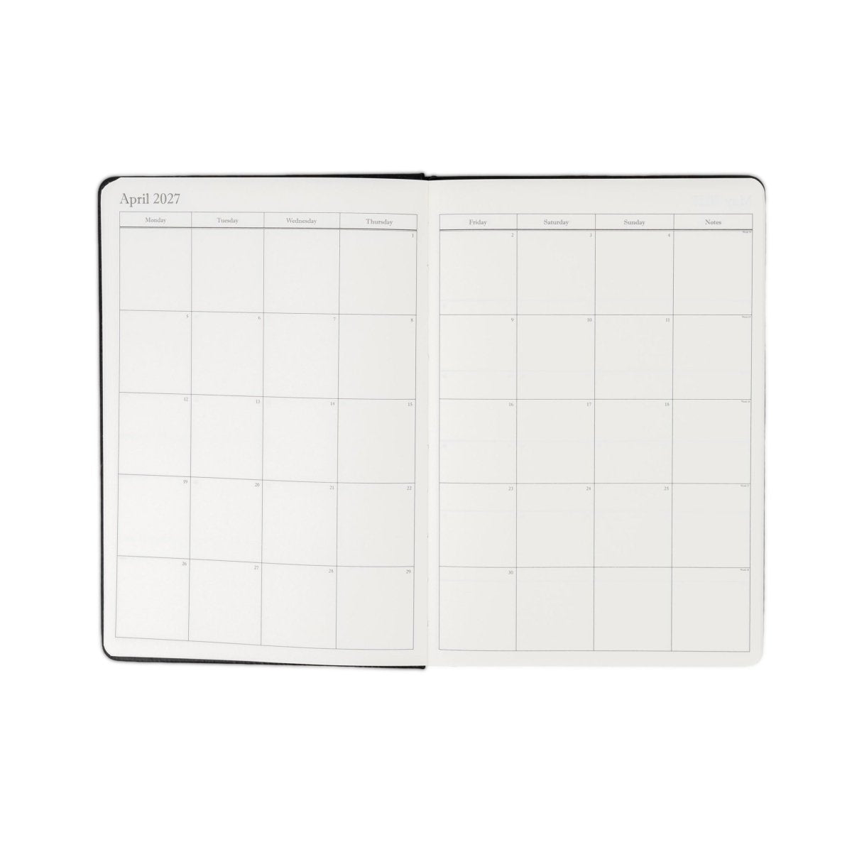 Weekly planner journal open to April monthly grid spread with dark edging