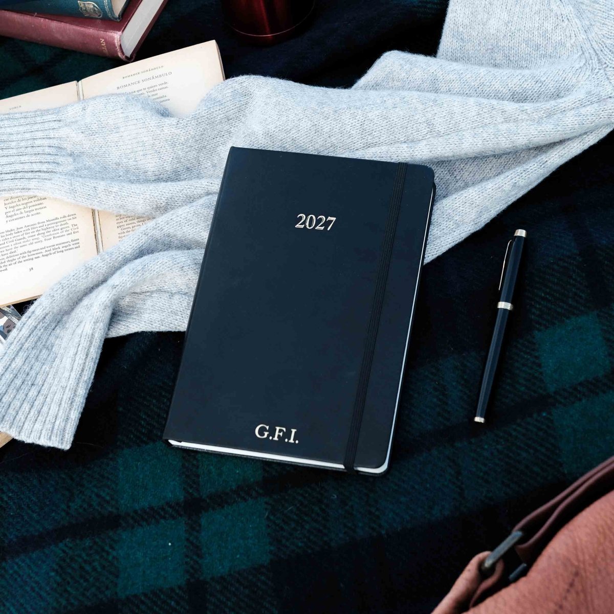 2027 planner journal, dark cover with "2027" text and "G.F.I." at the bottom