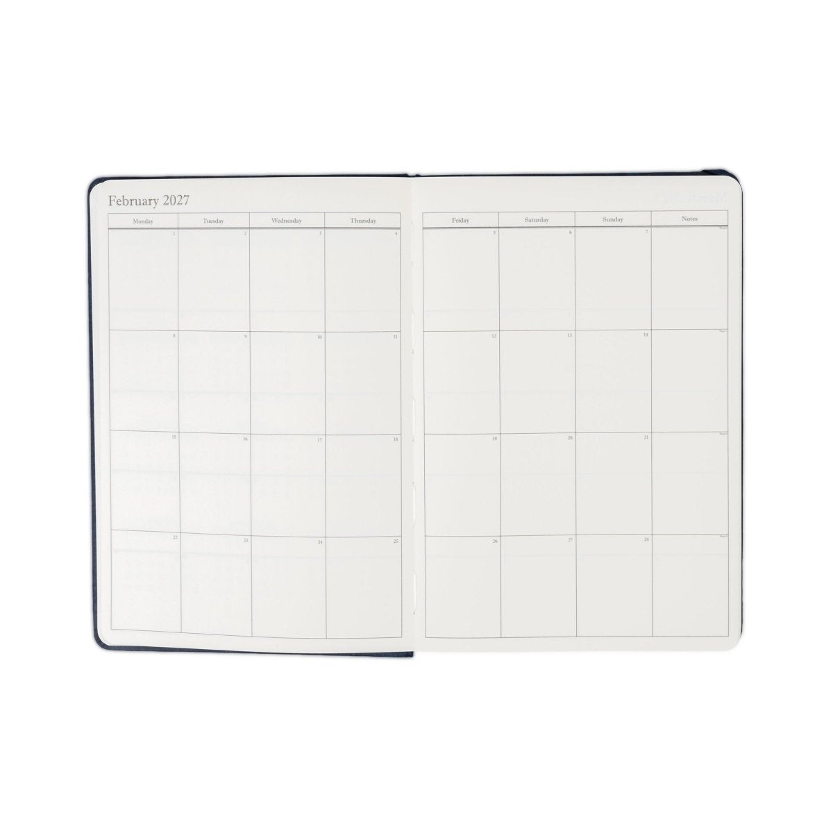 Weekly planner journal open to February monthly grid spread with dark blue edging